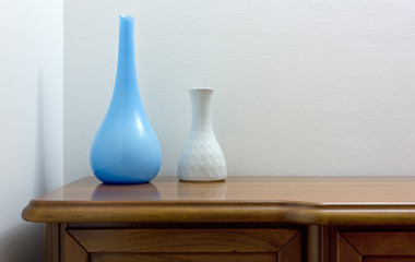 Two Elegant Vases on a Wooden Chest
