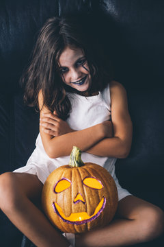 Malicious girl with pumpkin halloween