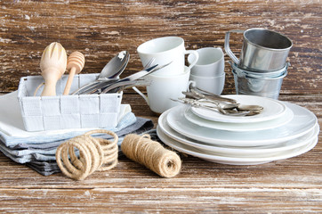 Kitchen Tools and helpers, food photography accessories background. Ceramic cups, silver spoons, linen napkins, wooden utensils, cookware. All you need for cook and make photo. - obrazy, fototapety, plakaty