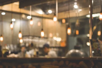 Foto op Plexiglas Abstract blurred bokeh (defocused) restaurant, cafe, bar, pub, nightclub, coffee shop or pizzeria background. Basic background for design. © yelena.b