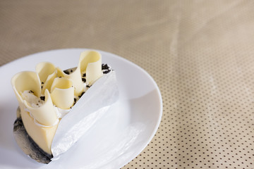 delicious white chocolate cake. tasty dessert on white plate. homemade bakery pastry