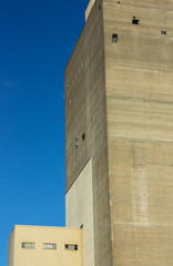 Old Abandoned Concrete Building Against Blue Sky