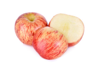 whole and cut ripe apple on white background