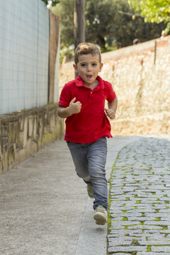 Boy Running Towards The Camera