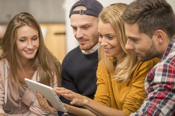 Rommates in apartment watching tv