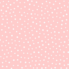 Irregular polka dots. Trendy seamless pattern. White circles on pink background. © Anne Punch