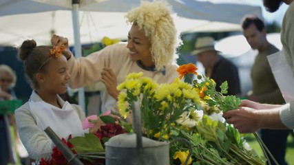  Mother & daughter working on a flower stall at the farmers market