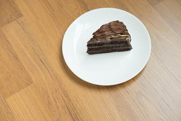banana caramel chocolate cake. tasty deliciouse dessert on white plate. homemade bakery pastry