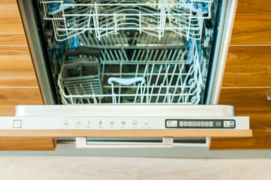 Kitchen Appliances And Interiors, A Dishwasher With An Open Door