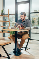 man reading magazine