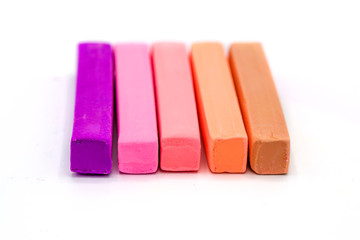 Colorful square pastel chalks on white background