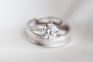 Wedding diamond rings on the black background