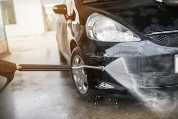 Pressure washing the car