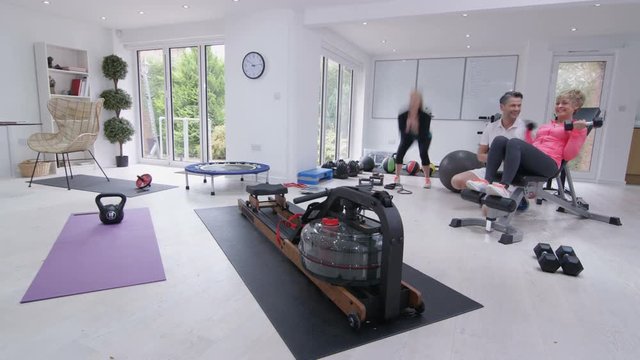 Time lapse healthy active mature group working out at the gym