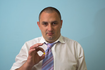 Businessman with a pill