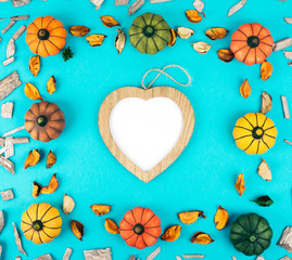 Decorative pumpkins on trendy blue background.