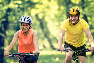 Naklejka premium Friends riding bicycles