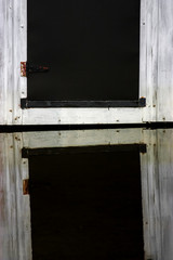 reflection of a black old wood door