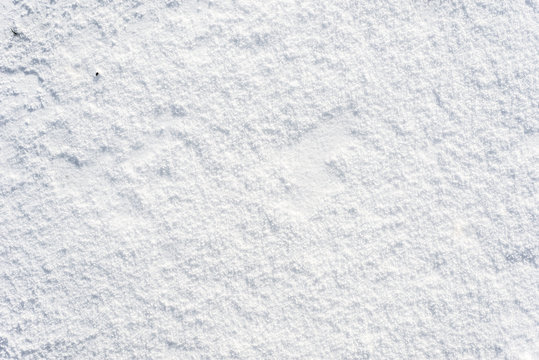 Clean snow texture, winter background, white surface with snowflakes