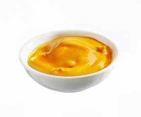 Bowl of creamy cheese dip for nachos