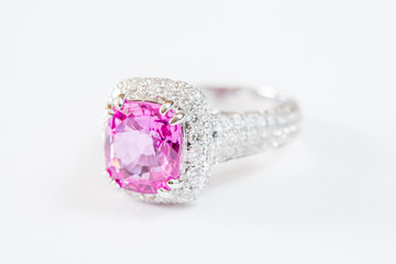Ring of the jewelry with pink sapphire isolated on white background