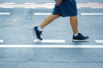 Man doing some jogging in the street. Urban sport. Empty copy space for Editor's text.