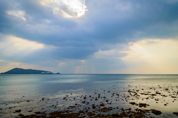 View of rocks on sandy beach in low tide, Phuket island
