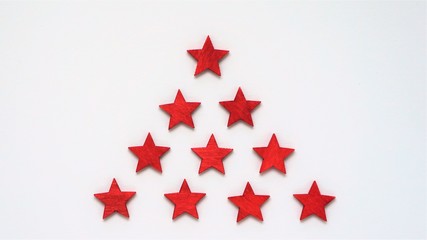 Christmas theme with red wooden stars on white background
