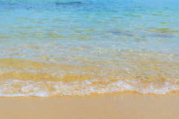 Soft Wave Of Blue Ocean On Sandy Beach. Background. Selective focus