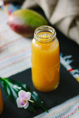 Fresh organic mango and orange smoothie.