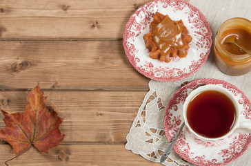 Homebaked Cake, Maple Leaf Shape. Cup Of Tea. Toffee Sauce. Top View.