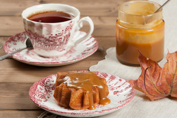 Homebaked Cake, Maple Leaf Shape. Cup Of Tea. Toffee Sauce.
