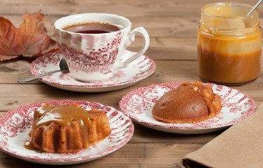 Homebaked Cake, Maple Leaf And Acorn Shape. Cup Of Tea. Toffee Sauce.