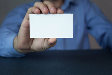 Businessman showing a business card