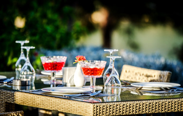 A nicely served table in a Turkish restaurant with a view of the sea in the summer sun.