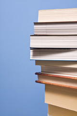 pale of books on blue wall