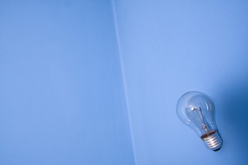 abstract wide angle electric bulb on blue wall