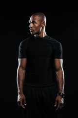 Portrait of young afro american sports man, looks away