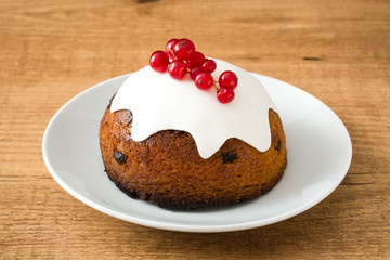 Christmas pudding on wooden table
