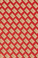 Craft paper present boxes tied from rope on red background. Pattern