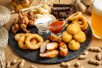 Fast food snacks composition with beer. Unhealthy junk food