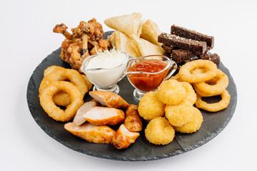 Fast food snacks composition with beer. Unhealthy junk food