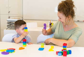teacher woman learn  preschooler boy to count