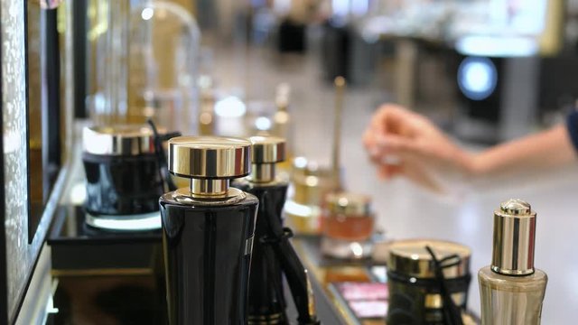 Woman Shopping in Luxury Parfume Boutique Store. Closeup On Parfume. 4K. 