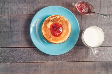 Small pancakes on a blue plate