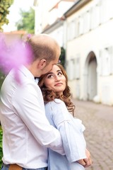 A loving couple is walking around the city. Warm autumn. Summer. Spring. Happy couple. Wedding. Love.