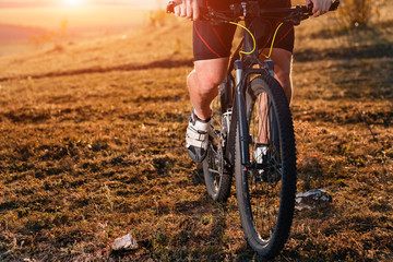 Naklejka premium Traveler with backpack Riding the Bike on the Beautiful autumn