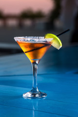 Special cocktail from the barman. Pouring alcohol to cocktail glass.