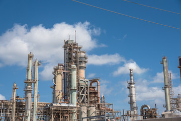 Oil refinery, oil factory, petrochemical plant in Corpus Christi, Texas, USA, cloud blue sky.