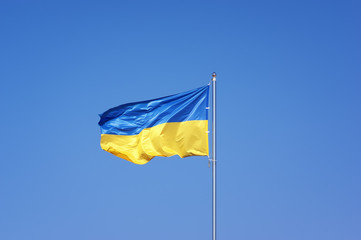 Ukrainian flag on blue sky backgroud